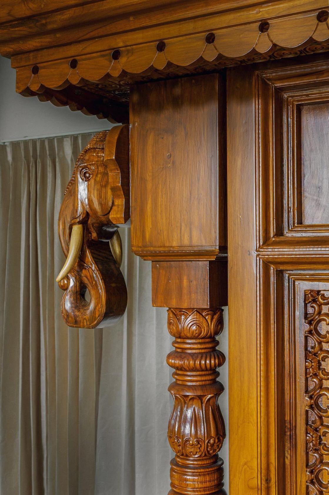 Carved elephant bracket on a turned timber pillar
