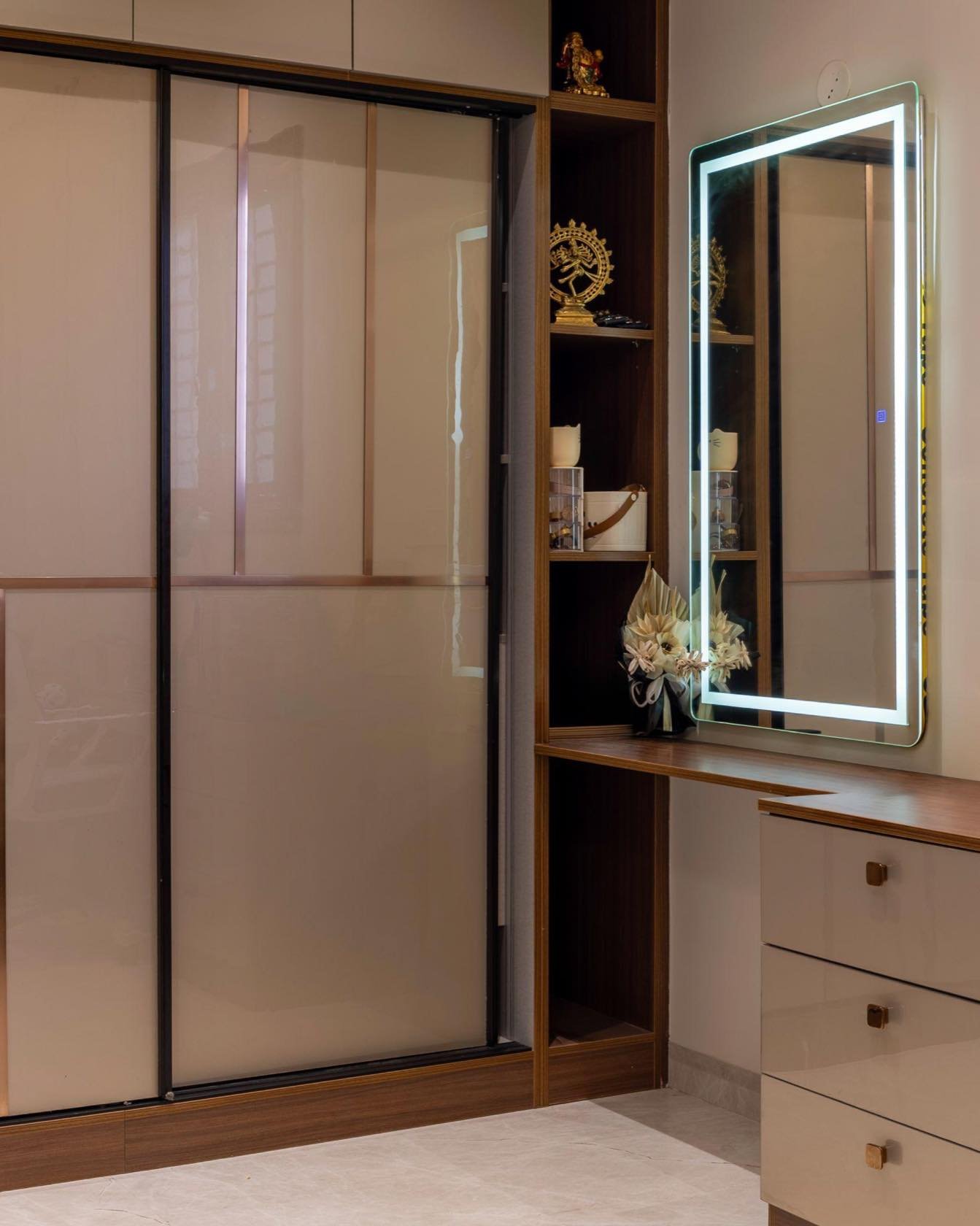 Sliding wardrobe with a dresser and profile-lit mirror