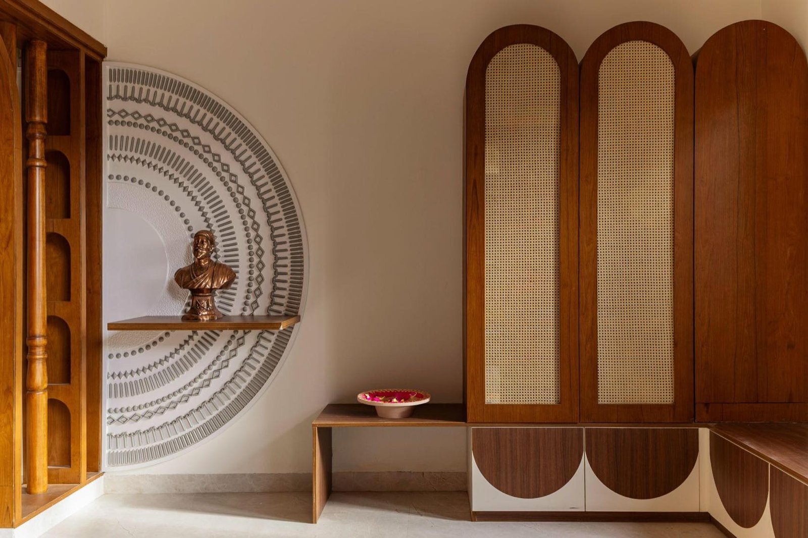 Carved mandala screen above a floating timber console