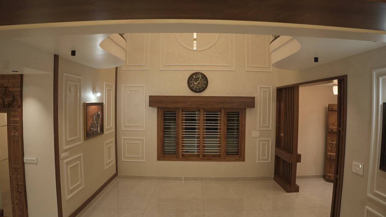 Living room with a timber window and moulded wall panels